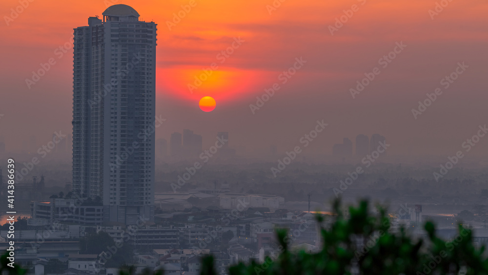The high angle background of the city view with the secret light of the evening, blurring of night lights, showing the distribution of condominiums, dense homes in the capital community The high angle background of the city view with the secret light of the evening, blurring of night lights, showing the distribution of condominiums, dense homes in the capital community