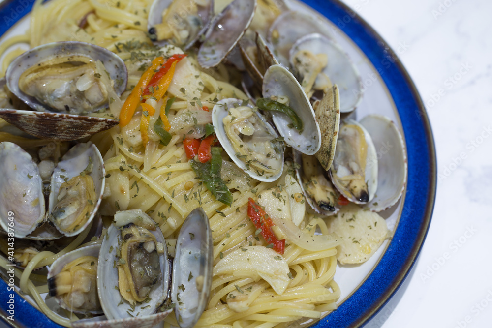 vongole clam oil pasta on the table.