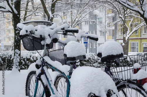 WINTER ATTACK - Bicycles and the city covered in snow