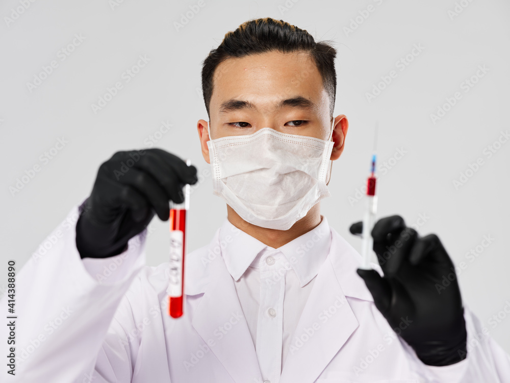 Asian male protective mask syringe with blood tests Asian male protective mask syringe with blood tests
