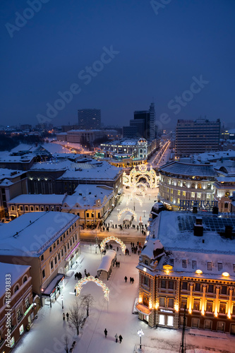 Night city, aerial view, Kazan. Snowy winter city. New Year street decorations