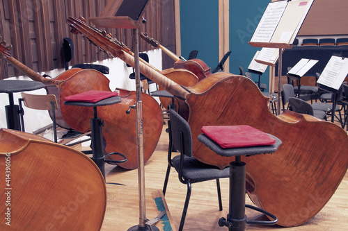 Close-up of contrabasses on a stage