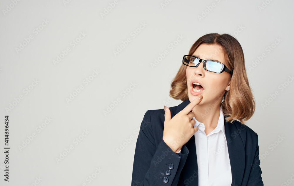 A business woman in a classic suit gestures with her hands Copy Space emotions A business woman in a classic suit gestures with her hands Copy Space emotions