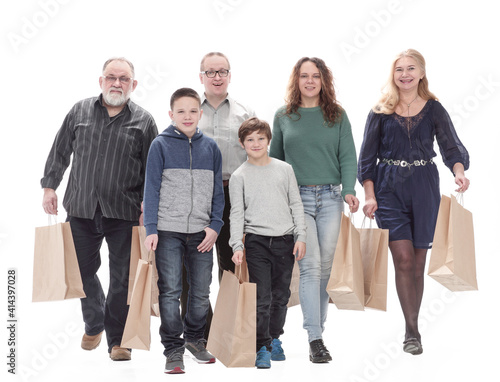 in full growth. family with shopping bags .