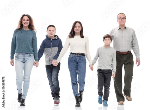 happy family in casual clothes walking forward.