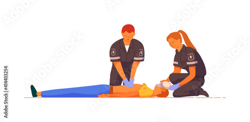 Paramedic giving indirect heart massage first aid to patient