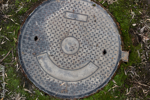 Metal manhole cover. Metal manhole background. Manhole. photo