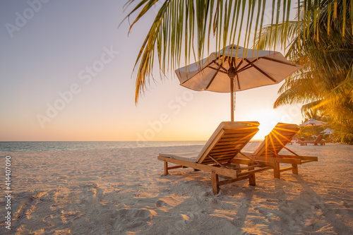 Fototapeta Naklejka Na Ścianę i Meble -  Beautiful beach. Chairs on the sandy beach near the sea. Summer holiday and vacation concept for tourism. Inspirational tropical landscape. Tranquil scenery, relaxing beach, tropical landscape design