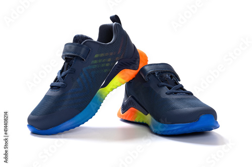 pair of blue sporty shoes for kid on white background