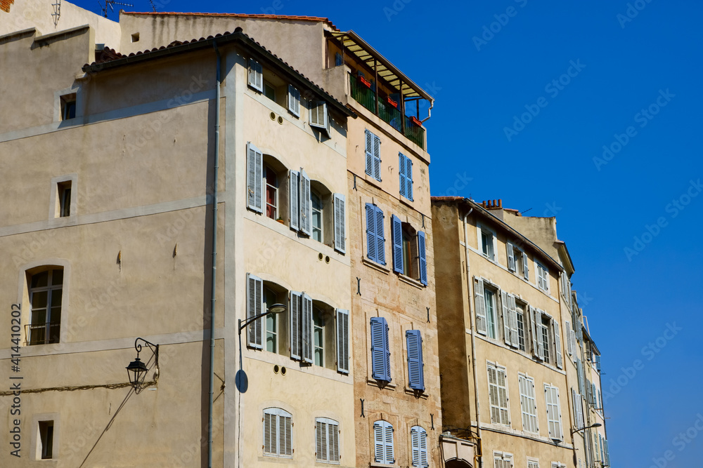  facade of provence style buiding in Marseille , France
