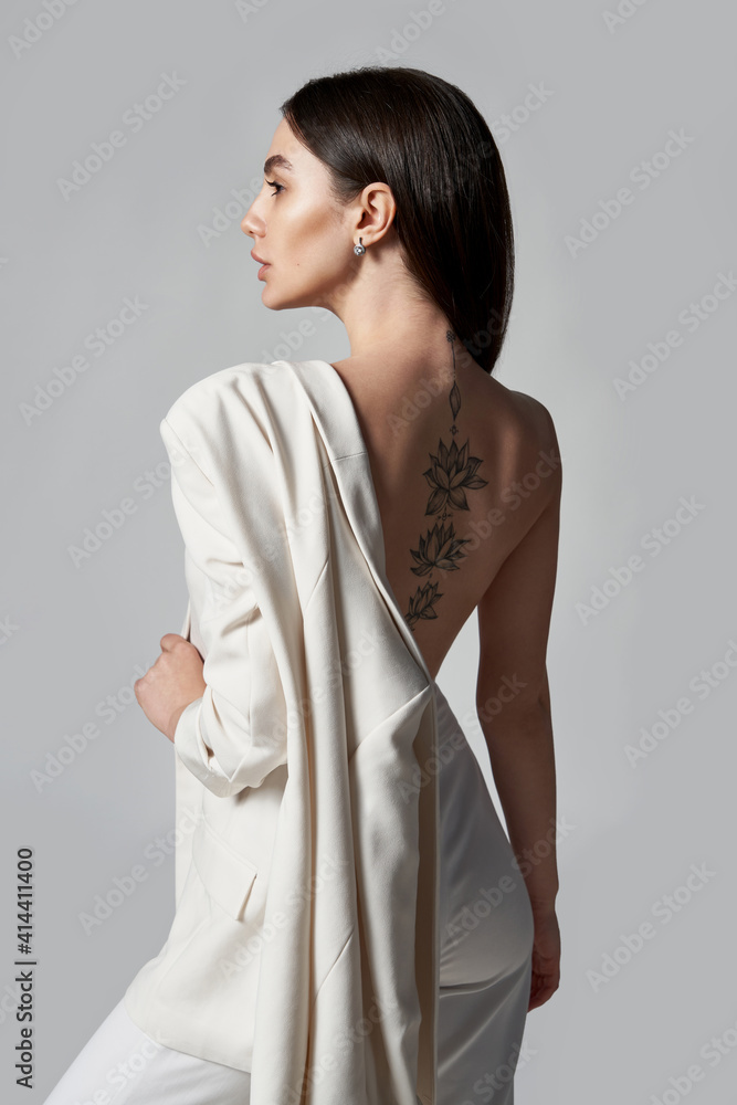 Fashion portrait of beautiful brunette woman in white jacket Fashion portrait of beautiful brunette woman in white jacket