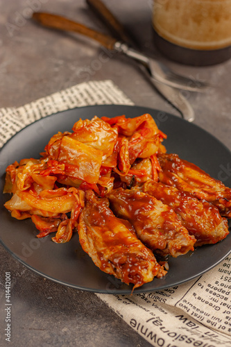 fast food chicken wings with stewed cabbage