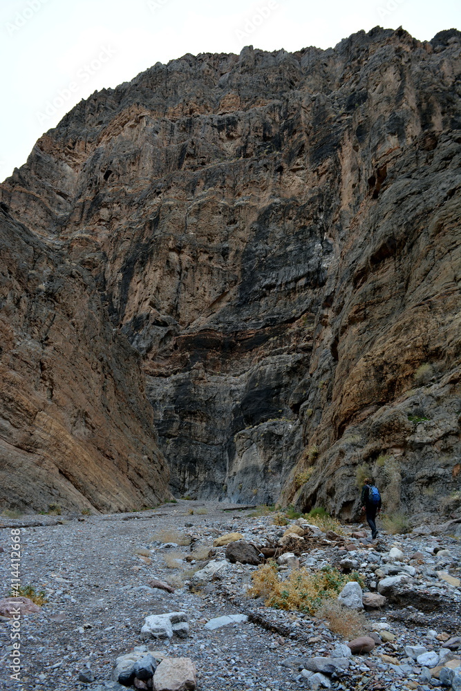 one person hiking in the titus canyon in the Death Valley National Park on a December day
