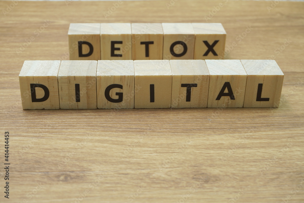 Digital Detox alphabet letter on wooden background Digital Detox alphabet letter on wooden background