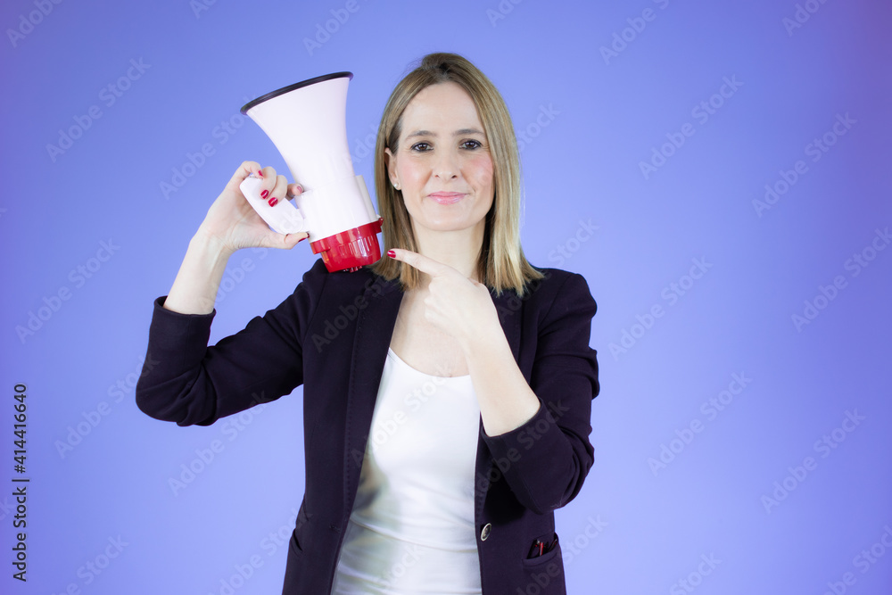 Business woman holding a megaphone over purple background. Business woman holding a megaphone over purple background.