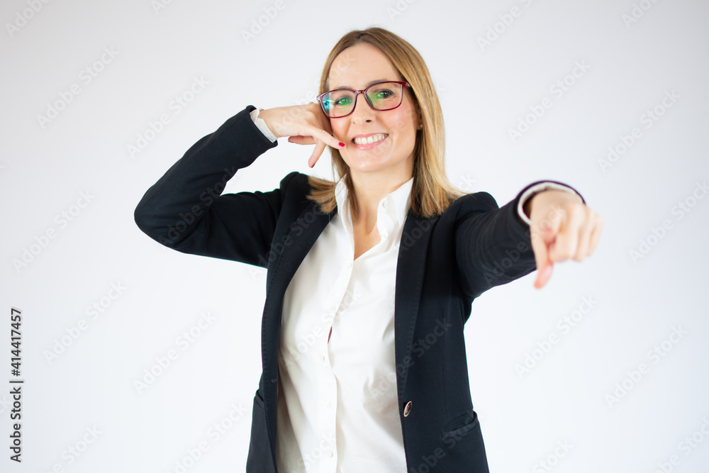 Young business woman makes telephone gesture over white background. Young business woman makes telephone gesture over white background.