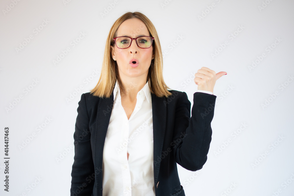 Amazed business woman showing thumb up over white background. Amazed business woman showing thumb up over white background.