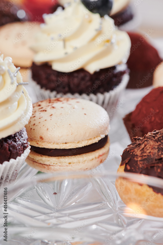 sweet catering. macarons and delicious desserts on the festive table. close-up sweet catering. macarons and delicious desserts on the festive table. close-up