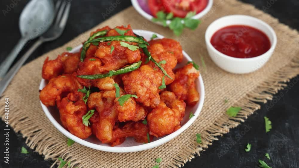 Gobi Manchurian dry, Gobi 65 popular Indian street food snack Delhi Mumbai India made cauliflower florets Veg Manchurian chilly gobi 4K slow motion footage video Indo Chinese side dish chapati roti Gobi Manchurian dry, Gobi 65 popular Indian street food snack Delhi Mumbai India made cauliflower florets Veg Manchurian chilly gobi 4K slow motion footage video Indo Chinese side dish chapati roti