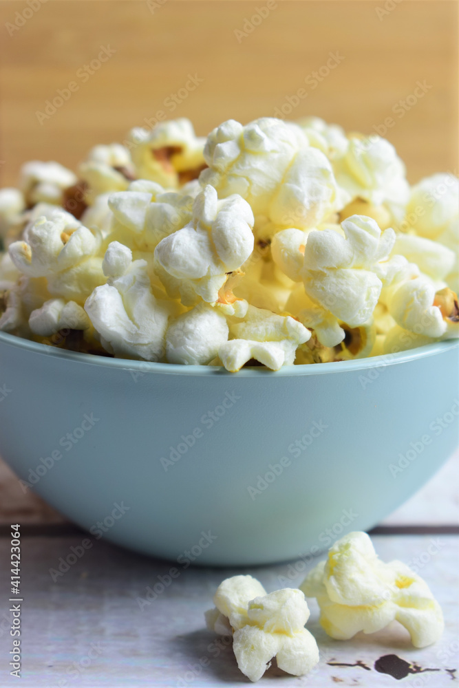 Closeup, popcorn in a bowl. Copy space. Closeup, popcorn in a bowl. Copy space.
