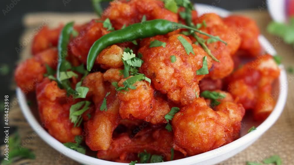Gobi Manchurian dry, Gobi 65 popular Indian street food snack Delhi Mumbai India made cauliflower florets Veg Manchurian chilly gobi 4K slow motion footage video Indo Chinese side dish chapati roti Gobi Manchurian dry, Gobi 65 popular Indian street food snack Delhi Mumbai India made cauliflower florets Veg Manchurian chilly gobi 4K slow motion footage video Indo Chinese side dish chapati roti