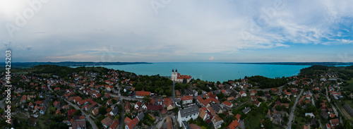 Aerial 180 degrees panoramic photo about Tihany city. Lake Balaton on the background. famous tourist destination with Hungarian monuments church and handmade gifts
