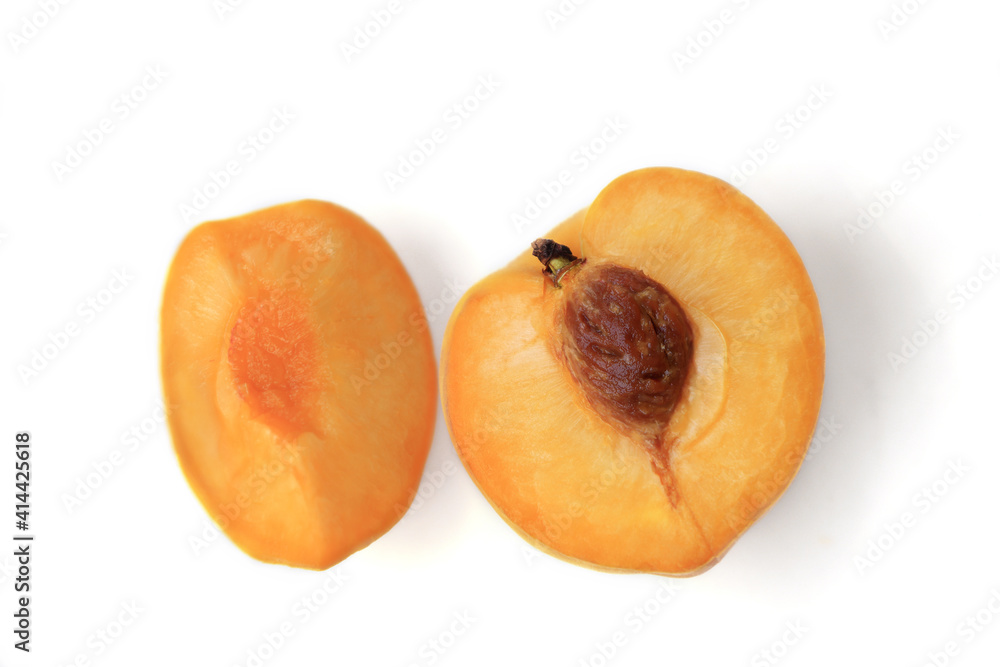 Ripe yellow peaches, delicious fruits of summer, isolated on white background.