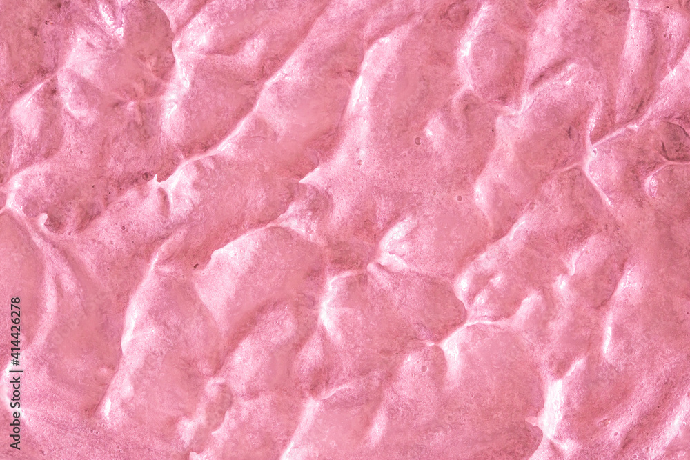 Pink cream texture. The surface of berry yogurt and a smoothie of whipped cream. Background texture of masks and scrubs for face and body. Pearlescent silver surface of pink foam. Pink cream texture. The surface of berry yogurt and a smoothie of whipped cream. Background texture of masks and scrubs for face and body. Pearlescent silver surface of pink foam.
