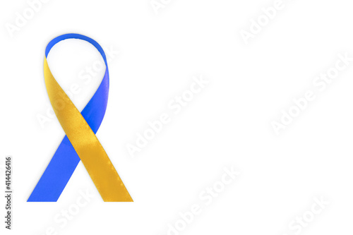 World Down Syndrome Day symbol. Yellow and blue ribbon on white background. 21 March