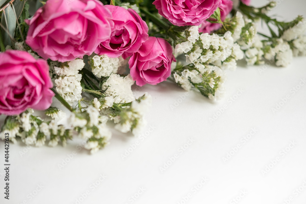 white dried flowers statice and rose raspberry peony on a white background . space for text white dried flowers statice and rose raspberry peony on a white background . space for text