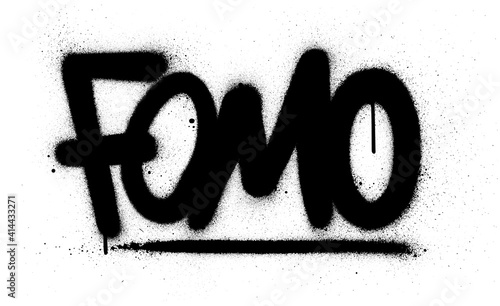 graffiti fomo abbreviation sprayed in black over white