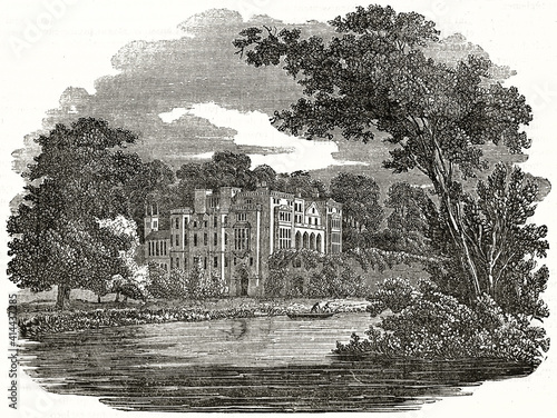 Guy's Cliffe manor house, England. Elegant aristocratic edifice surrounded by luxuriant garden and water. Ancient grey tone etching style art by unidentified author, Magasin Pittoresque, 1838 photo