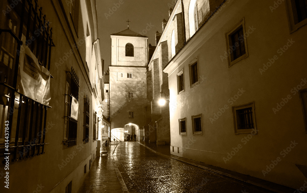 narrow street in the city in black and white 