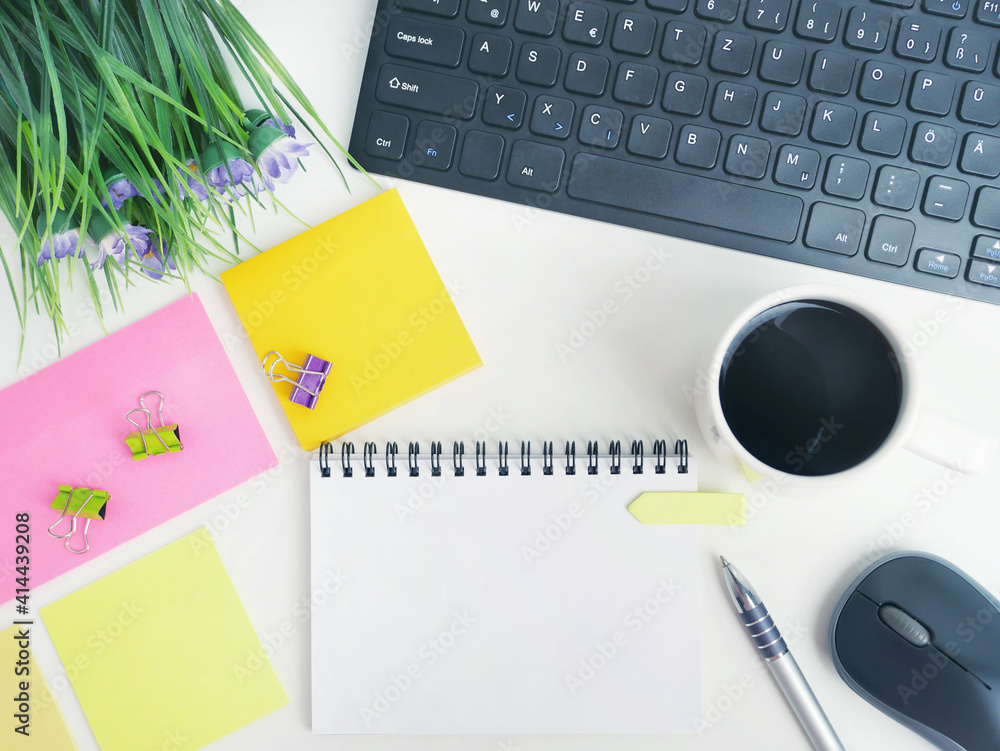 mock up flat lay of office workspace desk with coffee,blank notebook, electronic devices and computer. organizer mockup concept for blog or header image with space for text or copy space