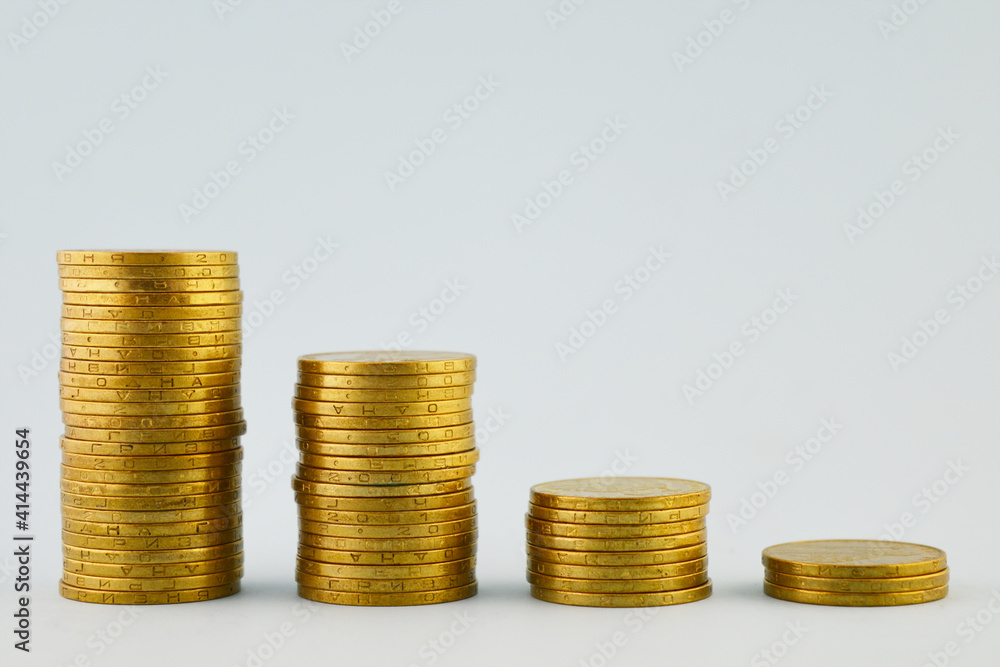 Metal coins are stacked in a column. Coins of Ukrainian hryvnia. Metal coins are stacked in a column. Coins of Ukrainian hryvnia.