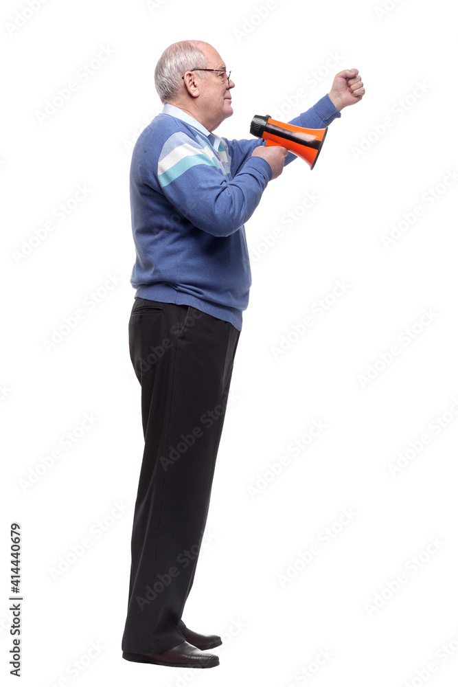 side view. senior man with a megaphone looking at a white screen. side view. senior man with a megaphone looking at a white screen.