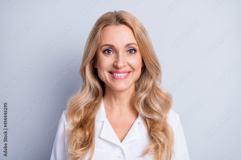 Portrait of curly hairstyle positive person toothy smile look camera isolated on grey color background Portrait of curly hairstyle positive person toothy smile look camera isolated on grey color background