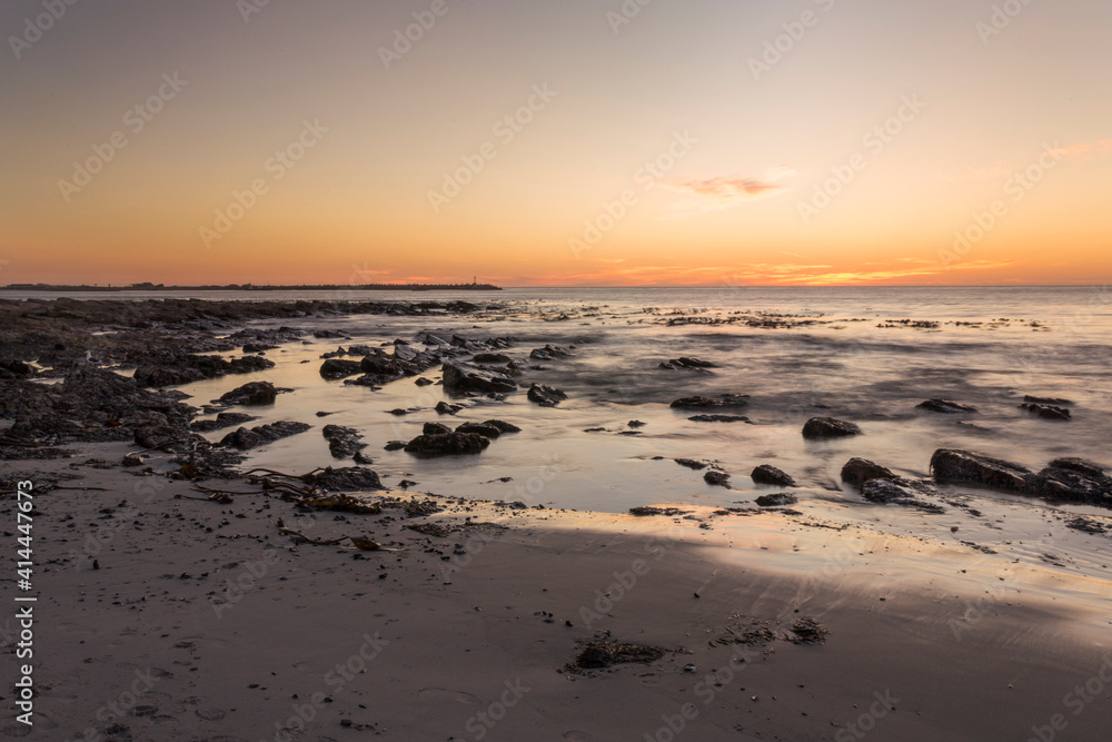 A sunset scene overlooking the coast and harbor in Lambert's Bay, Western Cape, South Africa, West Coast area.