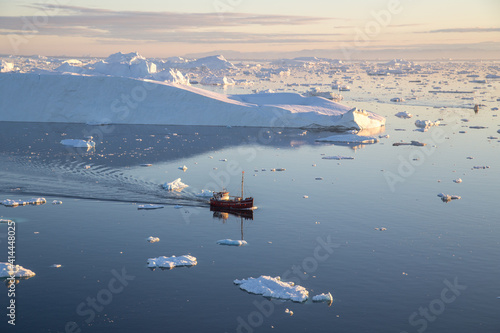 Red Fishing Boat in Ilulissat Icefjrod photo