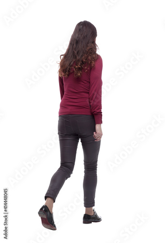 rear view. young woman in casual clothes walking away