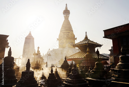 Swayambhunath stupa in Kathmandu  Nepal. Backlit smoke in the morning light.