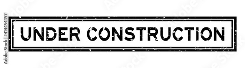 Grunge black under construction word square rubber seal stamp on white background