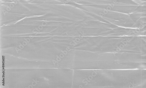 grey Background texture of a polyethylene,plastic transparent black plastic film,transparent stretched background photo