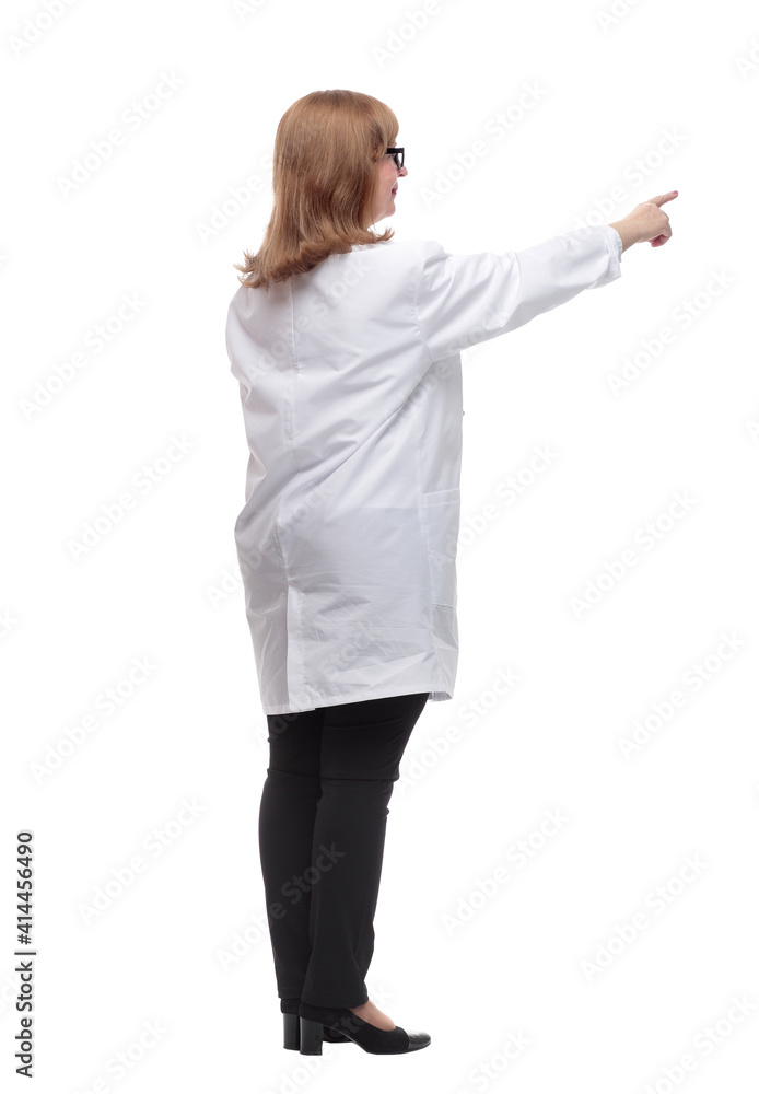 side view. serious female medic looking at a white screen side view. serious female medic looking at a white screen