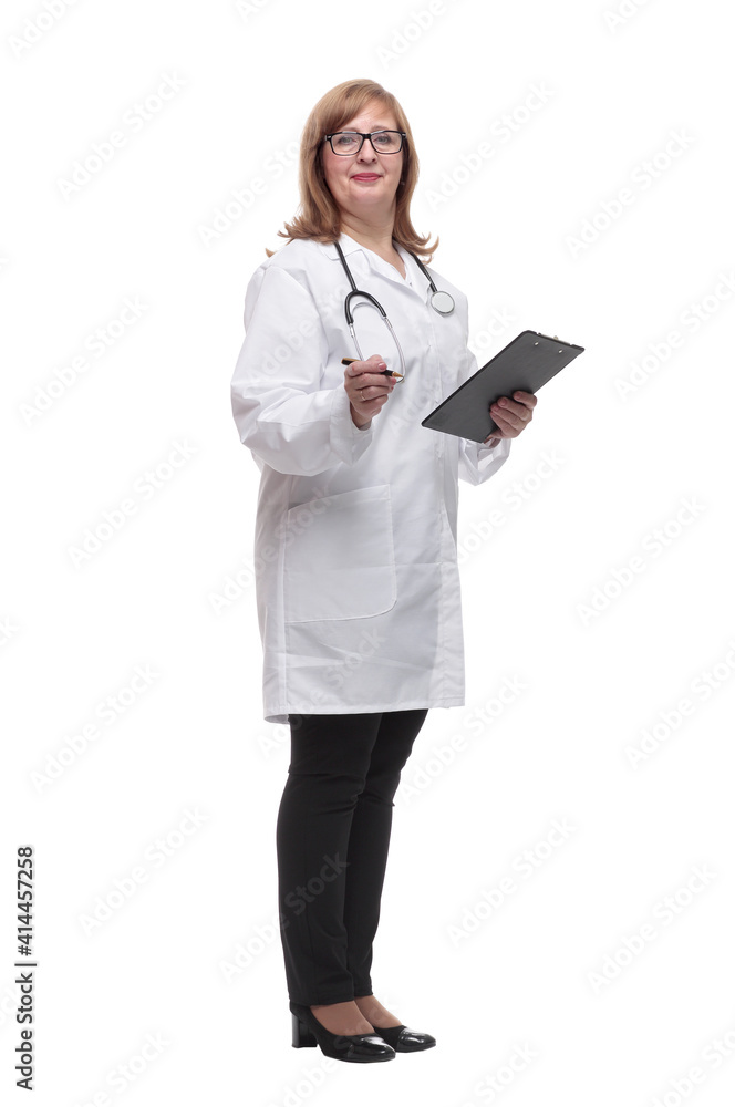 qualified female doctor making notes in the clipboard. qualified female doctor making notes in the clipboard.