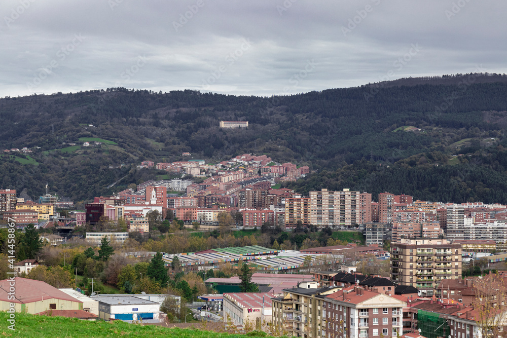 Fototapeta premium view of the city of bilbao from a mount at sunset