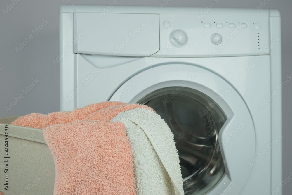 colorful laundry towels on the background of the washing machine colorful laundry towels on the background of the washing machine