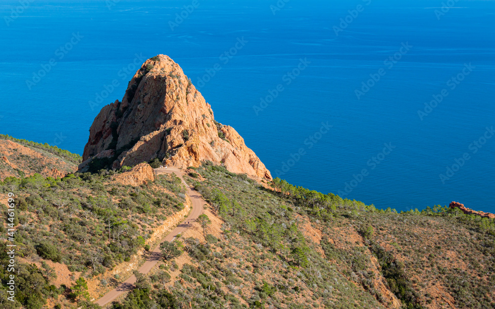 hiking trail near a peak of a mountain range on the seashore