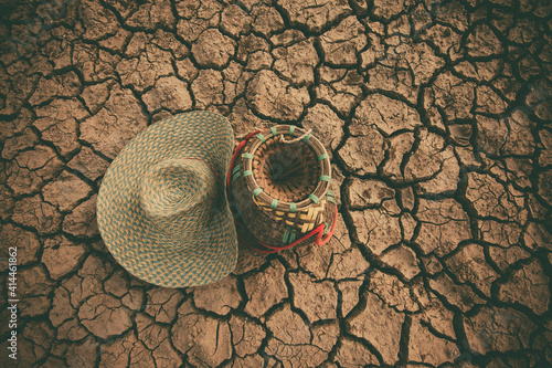 Hat on dry and cracked ground.Drought