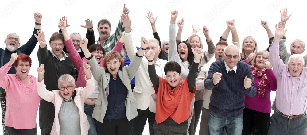 Group of smilig people with their hands in the air - isolated